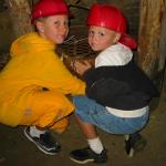 Cousins rub the "lucky bucket" (used by miners for good luck)
