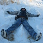 Isaac makes a snow angel