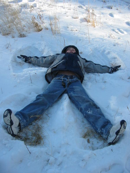 Isaac makes a snow angel