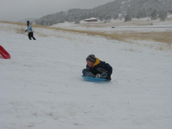 Fresh snow makes for great sledding at Meyer's Ranch park.  Isaac uses a saucer on this run.
