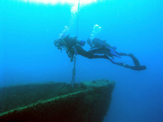 Divers At The Bow