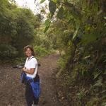 Debbie on the road, carrying my tripod