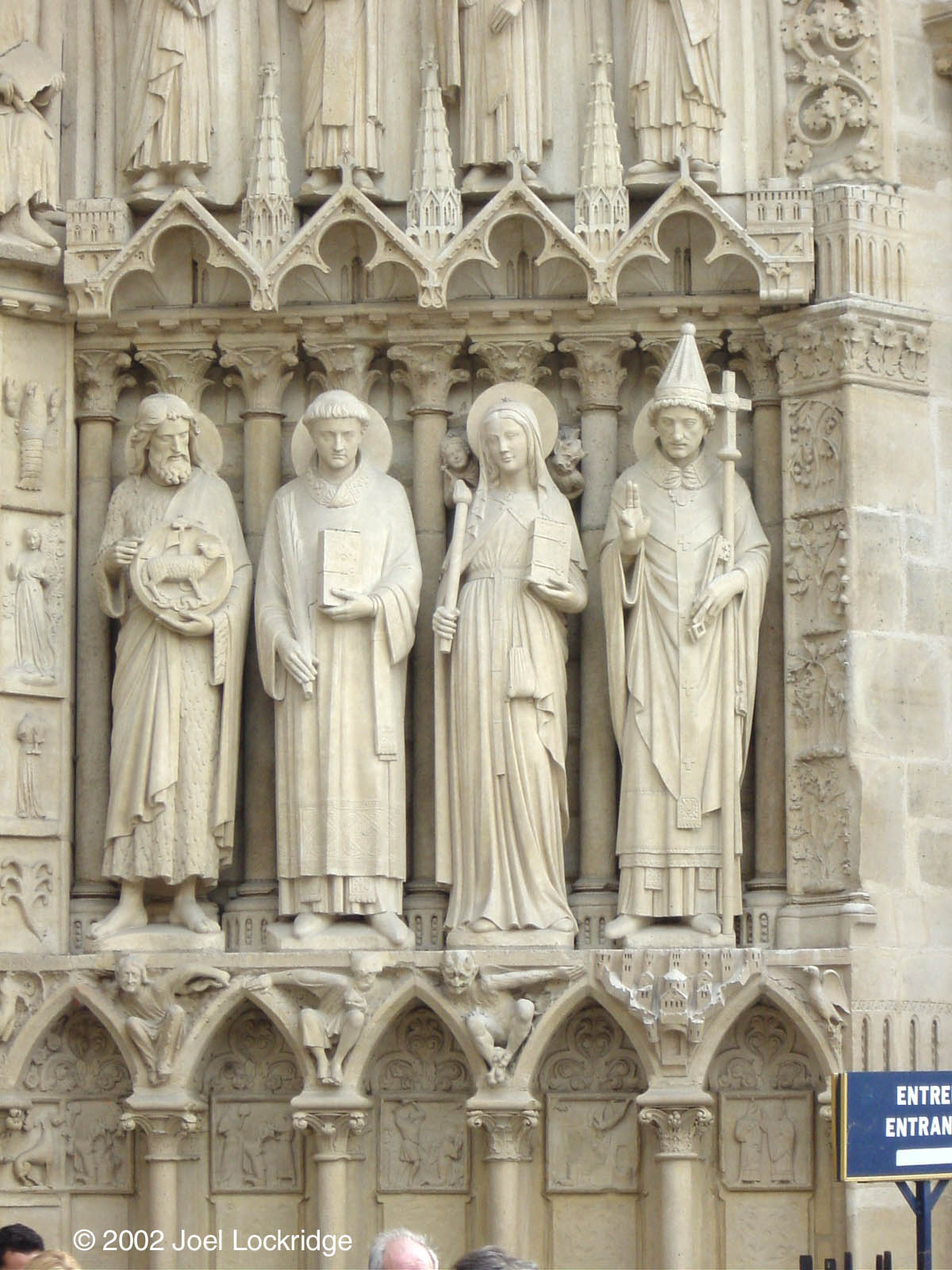 More of the doorway figures.  I'd love to know the history behind why they're standing on different objects.