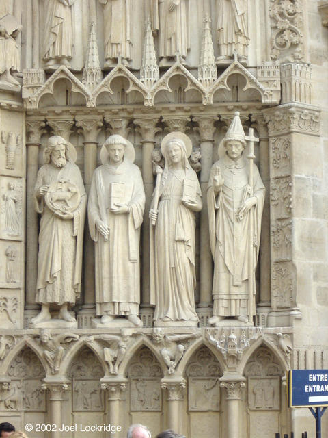 More of the doorway figures.  I'd love to know the history behind why they're standing on different objects.