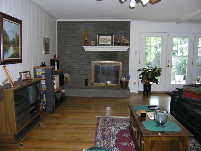Wood burning fireplace in living area 2- french doors to the backyard