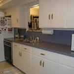 Right side of kitchen... with window to the 2nd living area and hallway to the bedrooms