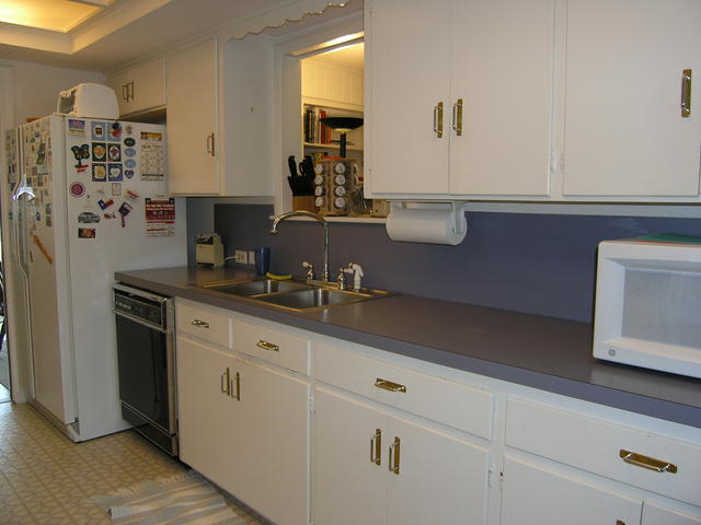 Right side of kitchen... with window to the 2nd living area and hallway to the bedrooms