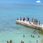 sunday with no cruise ships in town. the shops are closed and the locals are taking a dip! Mostly kids and some parents.