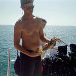 Graysen showing off one of the Lobsters Capt.. Jay speared.