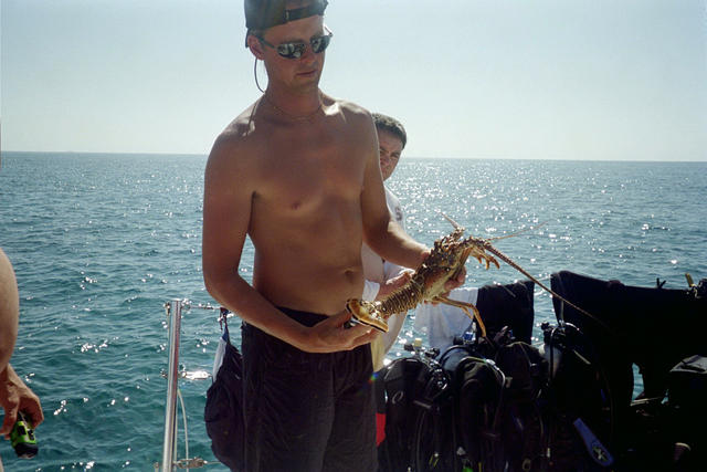 Graysen showing off one of the Lobsters Capt.. Jay speared.