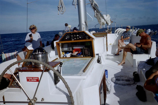 Picture of the Helm and just everybody milling around the boat.