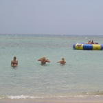 Sheryle and Anna make their way out to the water trampoline