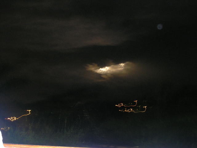 Watching the moon try to come out of the storm clouds